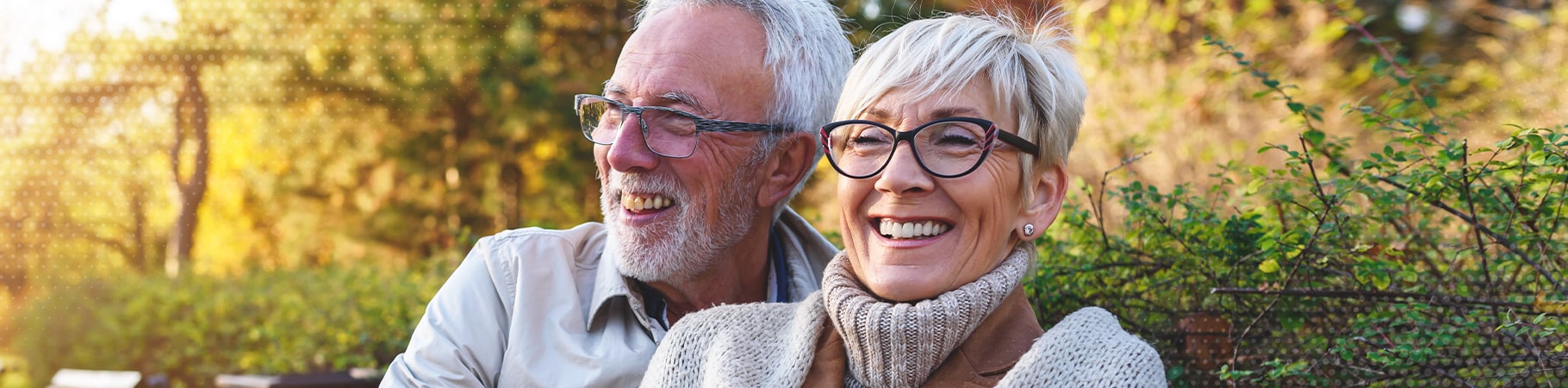 two mature people smiling